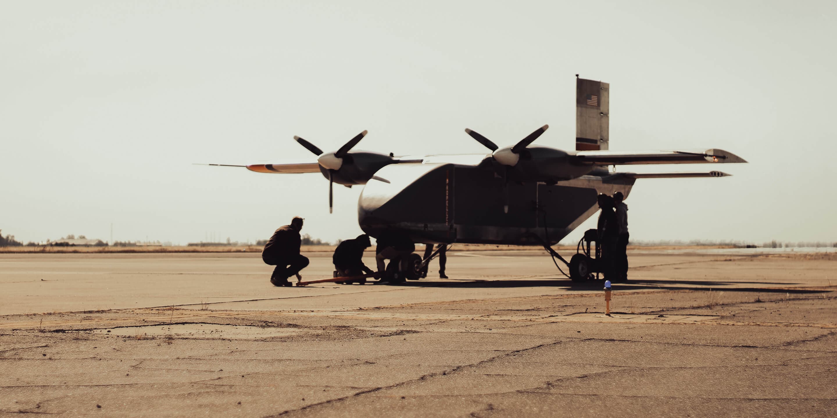 Lifter Lite aircraft with ground crew on the flightline