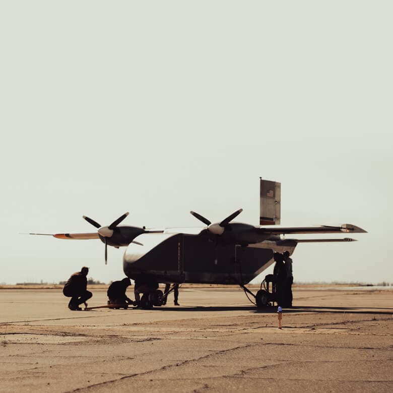 Lifter Lite aircraft with ground crew on the flightline